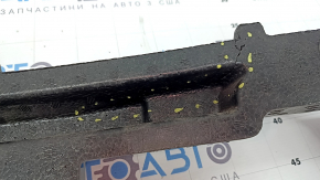 The front bumper upper absorber of the Lexus UX 19-26 is dented and cracked.