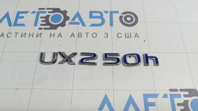 Emblem with the inscription "UX250h" on the trunk door of the Lexus UX250h 19-22