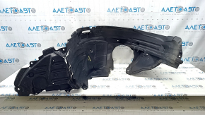 Subaru Forester 25-26 front left fender liner torn