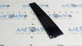 The rear right side door trim for a Lexus UX 19-26 is missing a seal, the fastener is broken, and it's covered in glue.