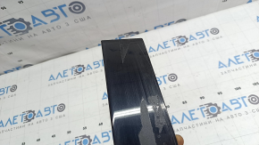 The rear right side door trim for a Lexus UX 19-26 is missing a seal, the fastener is broken, and it's covered in glue.