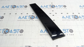The front right side door trim for a Lexus UX 19-26 is missing a seal, the fastener is broken, and it's covered in glue.
