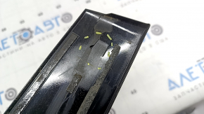 The front right side door trim for a Lexus UX 19-26 is missing a seal, the fastener is broken, and it's covered in glue.
