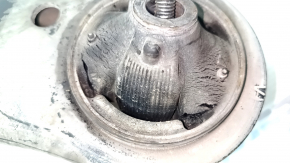 The lower front left control arm of a Toyota Highlander 20-26 is torn.