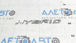 Emblem with the inscription HYBRID on the rear left door of the Lexus UX250h 19-22