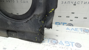 The rear engine guard of the Mercedes W213 E 17-23 AWD is cracked, worn, and missing a fragment.