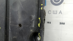 The rear engine guard of the Mercedes W213 E 17-23 AWD is cracked, worn, and missing a fragment.