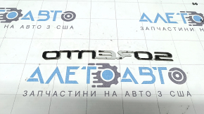 The SORENTO emblem on the Kia Sorento 23-25 trunk door