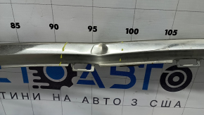 The rear bumper center molding for a 17-20 Lincoln MKZ is dented.