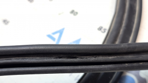 The trunk lid seal on a VW Jetta 11-18 USA is cracked.