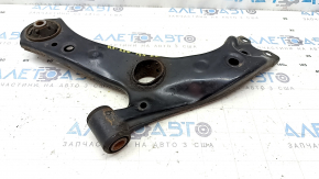 The lower front left control arm of the Lexus UX 19-26 is rusty, with microcracks.