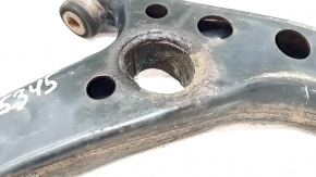 The lower front left control arm of the Lexus UX 19-26 is rusty, with microcracks.
