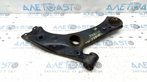 The lower front right control arm of a Lexus UX 19-26 is rusty, with microcracks.