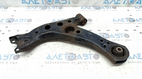 The lower front right control arm of a Lexus UX 19-26 is rusty, with microcracks.