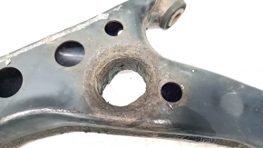 The lower front right control arm of a Lexus UX 19-26 is rusty, with microcracks.