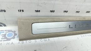 Lincoln MKZ 17-20 front left door sill plate, chrome with backlight, beige, scratches, needs cleaning