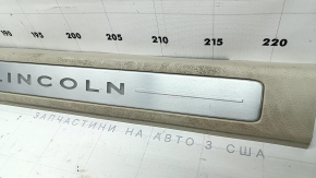 Lincoln MKZ 17-20 front left door sill plate, chrome with backlight, beige, scratches, needs cleaning