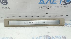 Lincoln MKZ 17-20 front right door sill plate, chrome with backlight, beige, scratches, needs cleaning