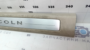 Lincoln MKZ 17-20 front right door sill plate, chrome with backlight, beige, scratches, needs cleaning