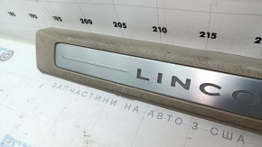 Lincoln MKZ 17-20 front right door sill plate, chrome with backlight, beige, scratches, needs cleaning