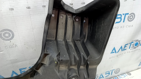 The rear left underbody protection of a Toyota Camry v70 18-24 hybrid is dented.
