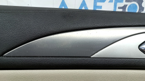 Beige front left door panel for a Lincoln MKZ 17-20, with beige leather insert, beige leather armrest, gray molding, brown upper part, with handle, dry-cleanable, scratches