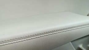 Beige front left door panel for a Lincoln MKZ 17-20, with beige leather insert, beige leather armrest, gray molding, brown upper part, with handle, dry-cleanable, scratches