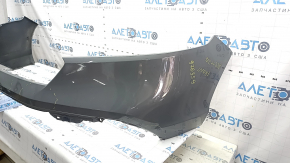 Bare front bumper for a 2023-2026 Honda Accord without parking sensors, gray, with chips and scratches.
