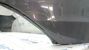 Bare front bumper for a 2023-2026 Honda Accord without parking sensors, gray, with chips and scratches.