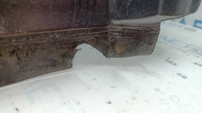 The front left fender liner of a Lincoln MKZ 17-20 is torn.