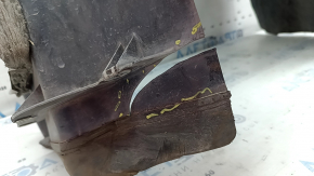 The front right fender liner of a Lincoln MKZ 17-18 is worn and broken.