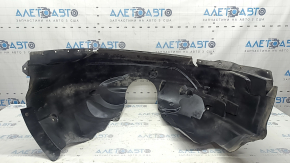 The front right fender liner of a Lincoln MKZ 17-18 is worn and broken.