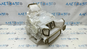 The bare heater housing of the Toyota Rav4 19-22 hybrid air conditioner, white housing, without radiators and actuators.