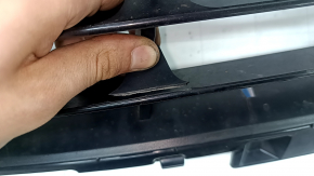 The lower grille of the front bumper, central BMW X2 F39 18-23, is cracked