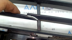 The lower grille of the front bumper, central BMW X2 F39 18-23, is cracked