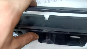 The lower grille of the front bumper, central BMW X2 F39 18-23, is cracked