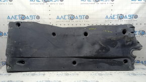 The left underbody protection of a VW Tiguan 18-24 is worn, cracked, and the mount is broken