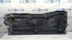 The left underbody protection of a VW Tiguan 18-24 is worn, cracked, and the mount is broken