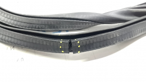 The front left door seal of the Lincoln MKZ 13-20 is torn and worn