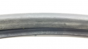 The front left door seal of the Lincoln MKZ 13-20 is torn and worn