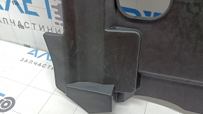 The lower front panel trim for the driver's footwell of the VW Atlas 20-23 is black, with backlighting, and is worn