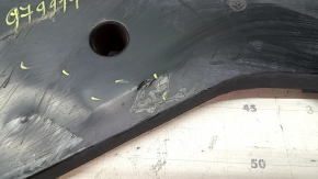 The rear left underbody protection of BMW 5 F10 11-16 is dented and worn