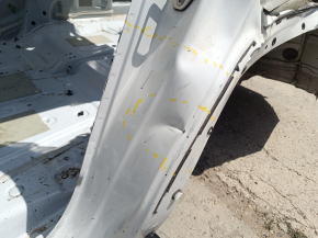 The central left body pillar of the VW Atlas 18-26 on the body with a sunset, dented