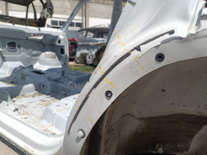 The central left body pillar of the VW Atlas 18-26 on the body with a sunset, dented