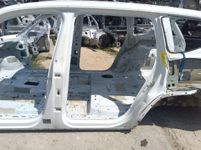 The central left body pillar of the VW Atlas 18-26 on the body with a sunset, dented