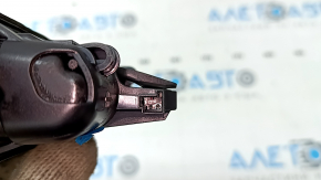 The button for opening the trunk lid of a BMW 5 G30 17-23 under the camera is worn out