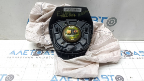 Black airbag in the driver's steering wheel of a Ford Edge 19-24, under active steering, shot, broken connectors