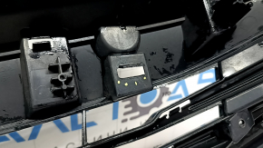 The base of the radiator grille of the Honda Accord 16-17 hybrid, with the emblem, is cracked, the fastener is broken