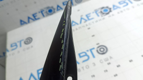 Triangle plug for the right rear wing of a Nissan Ariya 23-26 with black molding, bent, scratches
