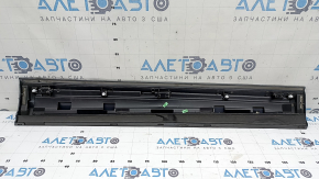 The lower front left door trim of the Audi Q3 8U 16-18 is worn and dented